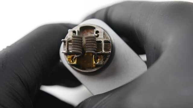 Vaping atomizer with clapton coil is working. Vape device or cigarette.