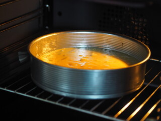 Home cooking.Sponge cake with pineapple on a dark background.