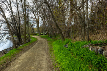 Fototapeta premium landscape of fresh grown grass waterfront tourist trail on Montebello, Quebec, Canada