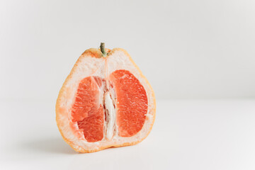 sliced grapefruit on a white background