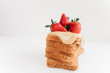 toast bread with peanut paste and strawberries