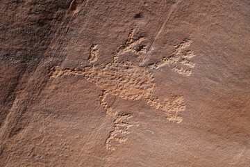 Basketmaker Petroglyphs of an alien carved into a rock wall in Indian Creek, Utah.