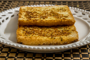 Garlic bread toast being served in a plate