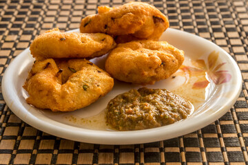 vada for the morning breakfast and evening snacks being served on the table 
