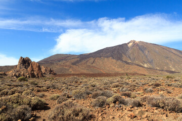 Volcano Mount Teide peak and rock formations Roques de Garcia in Teide National Park on Canary Island Tenerife, Spain