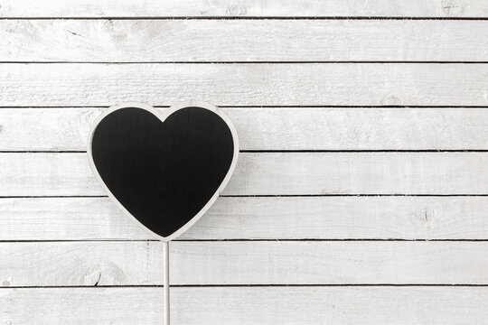 White heart on dark wood Stock Photo by ©insek1 54129067