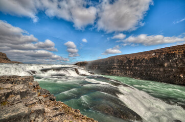 Gullfoss, Emblematic stepped waterfall located at a pronounced elbow of the Hvita River. Iceland..