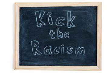 Kick the racism - written on chalkboard. Concept message