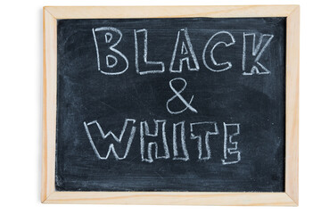 Black and White - written on chalkboard. Concept message