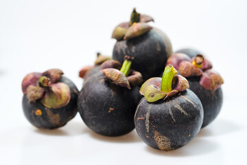 mangosteen fruits placed on a white background