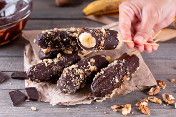 Homemade Frozen Chocolate Covered Bananas on a Stick.