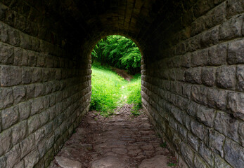 Stone tunnel for pedestrians in the park