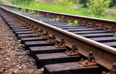 Railroad with wooden sleepers in the forest