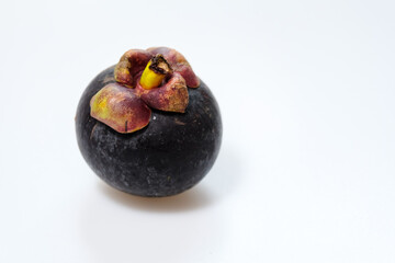 mangosteen fruits placed on a white background