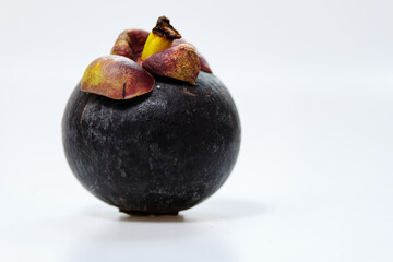 mangosteen fruits placed on a white background