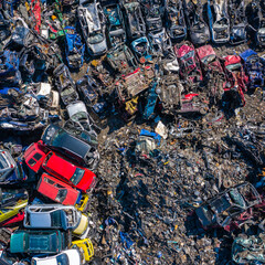 Scrapyard Aerial View. Old rusty corroded cars in car junkyard. Car recycling industry from above.