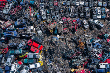 Scrapyard Aerial View. Old rusty corroded cars in car junkyard. Car recycling industry from above.