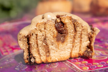 Cinnamon roll and nature with flowers in the background