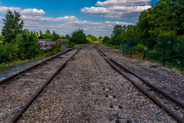 A view along a disused railway line above the Birmingham Canal in summertime