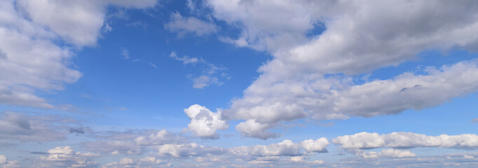 September is the autumn sky.
Panoramic photo of dense clouds flying low above the ground.