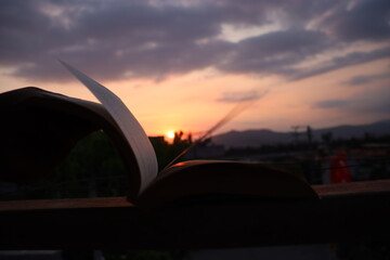 open book with sunset