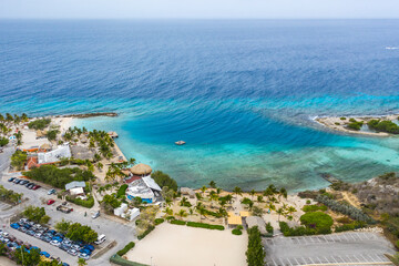 Fototapeta na wymiar Aerial view of coast of Curacao in the Caribbean Sea with turquoise water, cliff, beach and beautiful coral reef