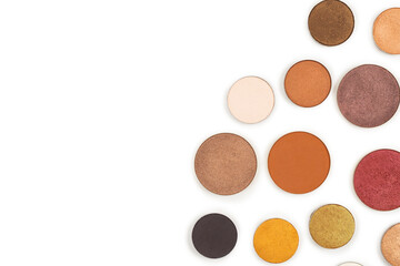 Round multicolored make up eyeshadows isolated on white.