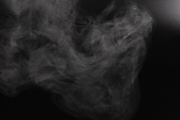 White steam on a black background.