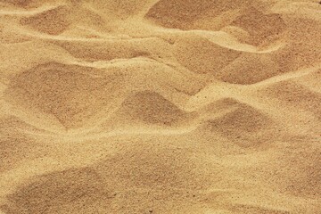 closeup of sand pattern of a beach in the summer