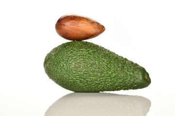 Green fresh ripe tasty avocado, close-up, on a white background.