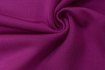 Background texture of pink fabric, soft napped insulating fabric made of polyester, wavy pattern, top view