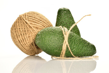 Green fresh ripe tasty avocado, close-up, on a white background.