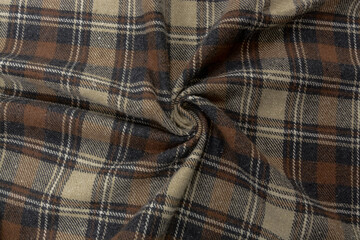 Flannel Fabric Texture. Brown fleece flannel fabric with a check pattern, background, drapery, top view