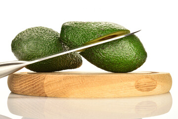 Green fresh ripe tasty avocado, close-up, on a white background.
