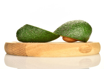 Green fresh ripe tasty avocado, close-up, on a white background.
