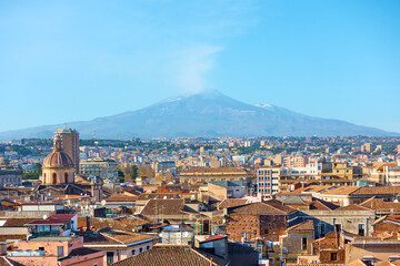 Catania and smocking Etna volcano