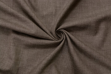 Fototapeta premium Brown linen fabric background, drapery, top view natural linen