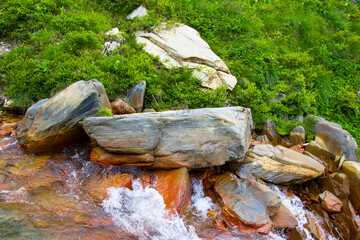 Rock and stone close-up and texture. Nature background, rock texture, river water.