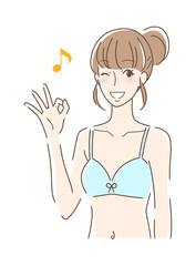 笑顔でOKサインを出す女