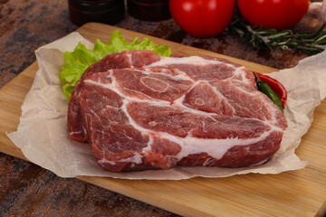Raw pork neck steak