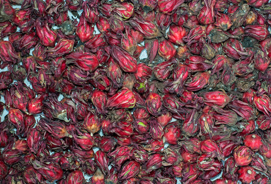 Penang, Malaysia - January 21, 2020 : Armenian Street,Roselle is also widely used as a folk medicine to lower blood pressure and fruits juice. Pile of dried red roselle for sale in market.
