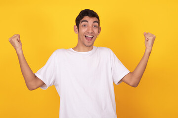 Fototapeta premium young teenager man with jubilant expression isolated on color background