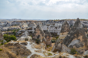 Unique fancy geological mountain formations with dovecotes of the Pigeon valley in Goreme, Cappadocia, Turkey