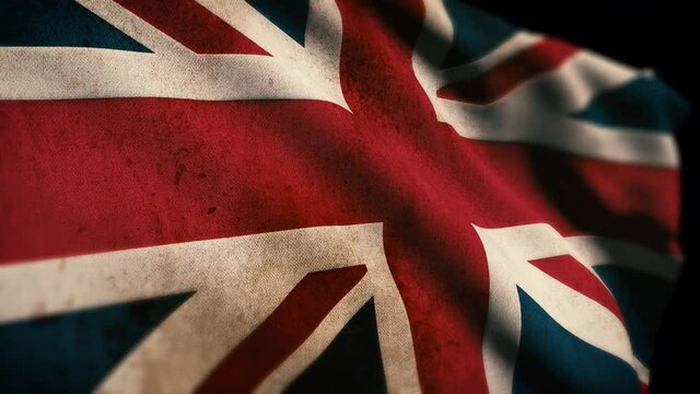 British Union Jack flag of England, dirty and gritty, covered in grime waving in the wind