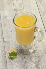 Dietary vegetarian oats milk over wooden