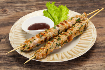 Minced pork skewer kebab with sauce