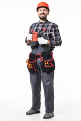 Handsome handyman in uniform with tool belt holding drill isolated on white