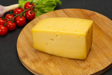 Hard yellow tasty cheese brick