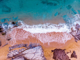 Fototapety  Аerial view. Rocks on the coast of Lloret de Mar in a beautiful summer day,sandy beach, Costa Brava, Catalonia, Spain