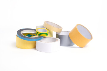 A heap of packing tape and a masking tape isolated on white background, with clipping path. adhesive tape. Scotch tape.

